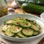 Din Tai Fung cucumber recipe with sesame seeds, chili flakes, and fresh garnish